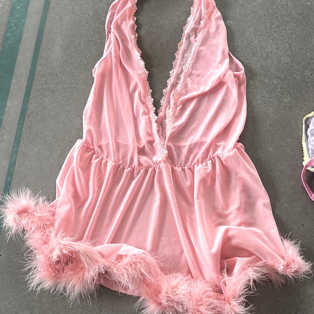 Sheer pink night slip with feather hem